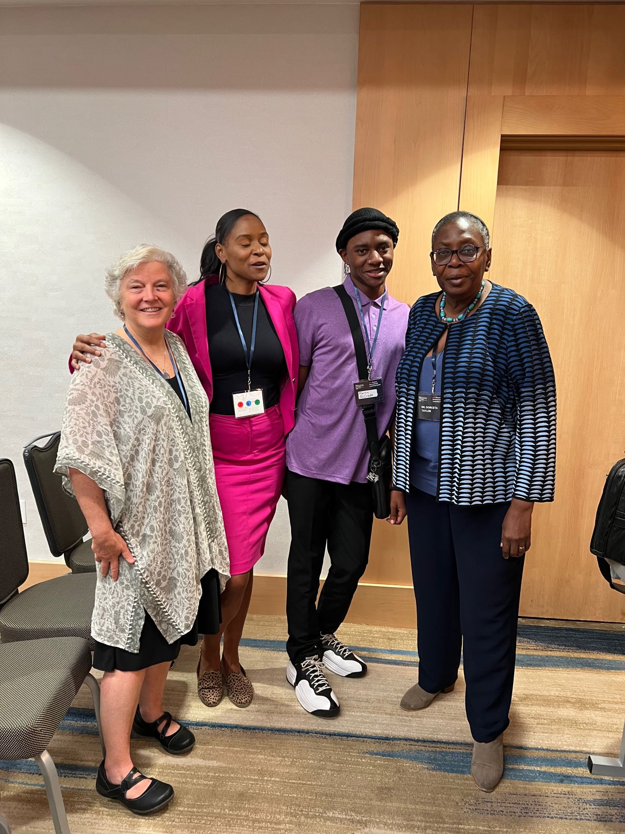 Dr. Dorceta E. Taylor, Martin McCrabb, Jerri Taylor and Martin's mother standing.