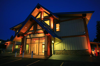Quilakwa Center — Featuring huge cedar columns and crooked Douglas Fir collar beam. Photographer, Peter Sperlich. Photo courtesy of Wood Design & Building Awards.